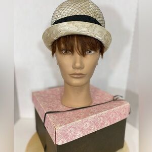 Brocade golden vintage bubble hat with black netting & silk ribbon. circa 1950s.